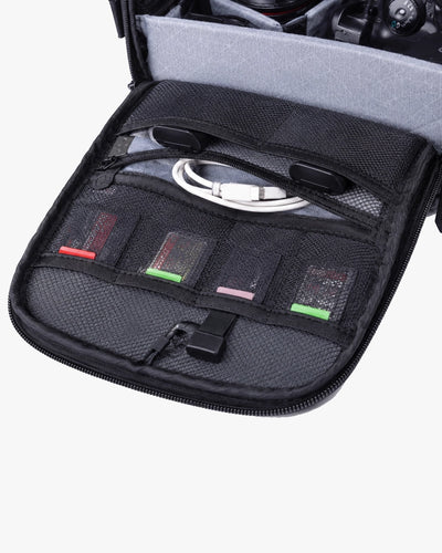 painel frontal mesh l-device cartões sd cabos bateria extra flash visível acessível imediatamente shoulder bag fotográfica organizada